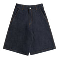 Dark indigo, raw denim shorts with contrast brown-orange stitching, a 'neuricos' logo button, YKK zipper and belt loops, shown flat on a white background.